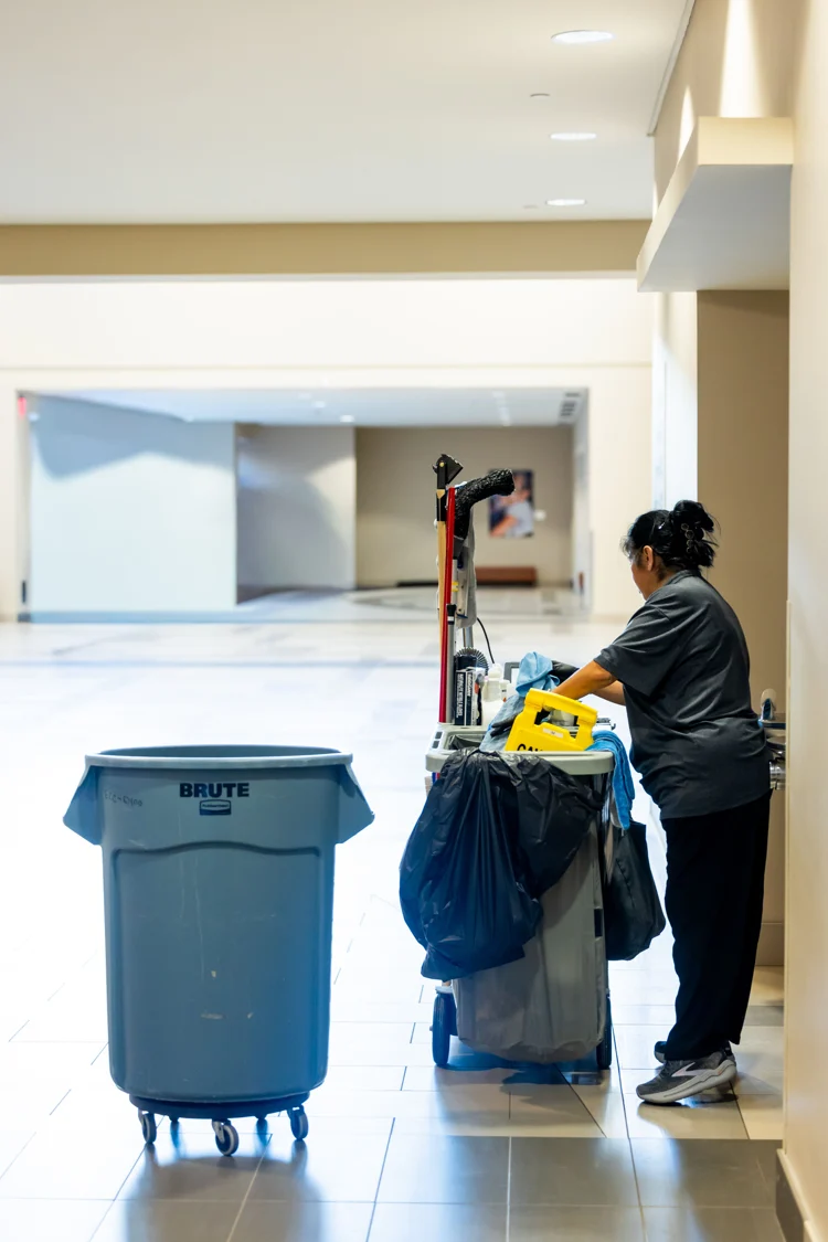 Cleaning professional maintaining a commercial hallway