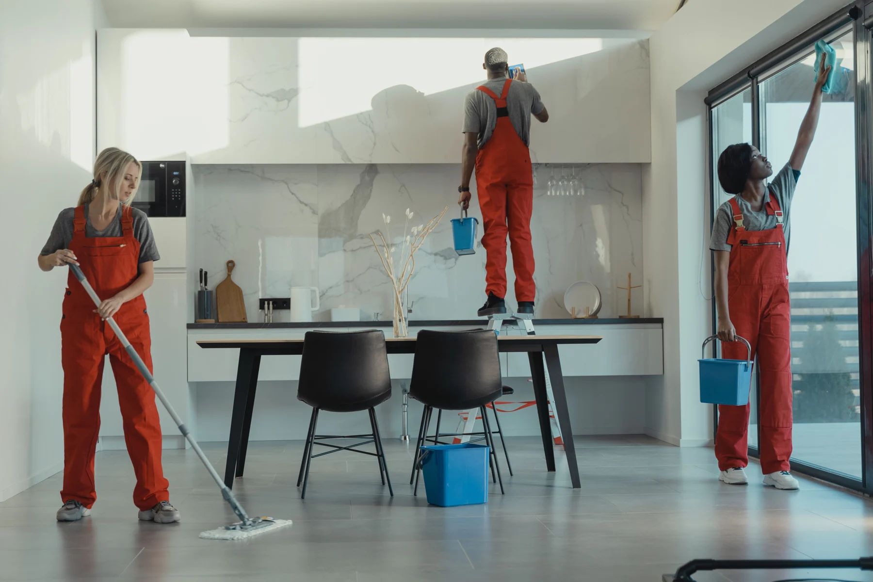Professional cleaning team caring for a bright, modern interior
